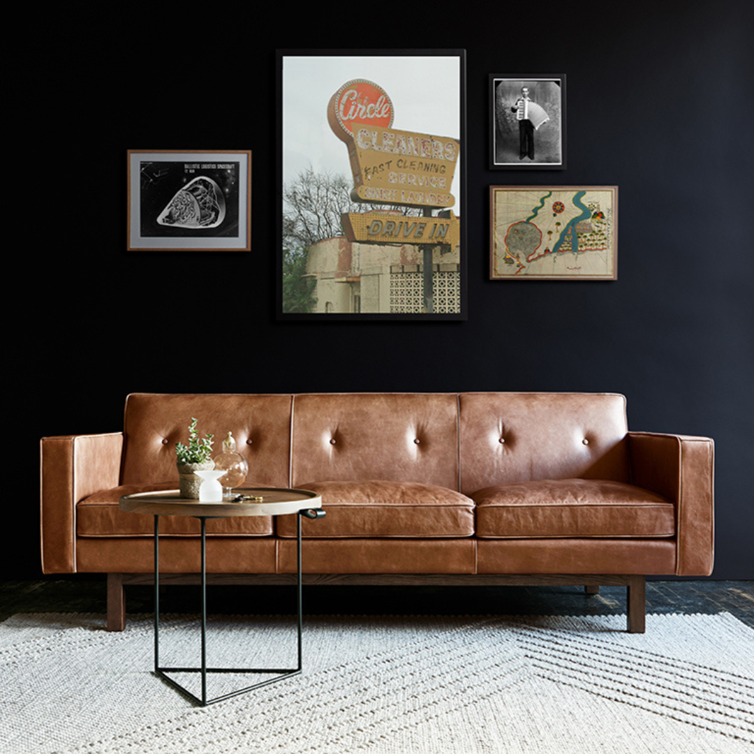 Embassy Chair Saddle Leather Brown Lifestyle Image in Living Room with Gallery Wall