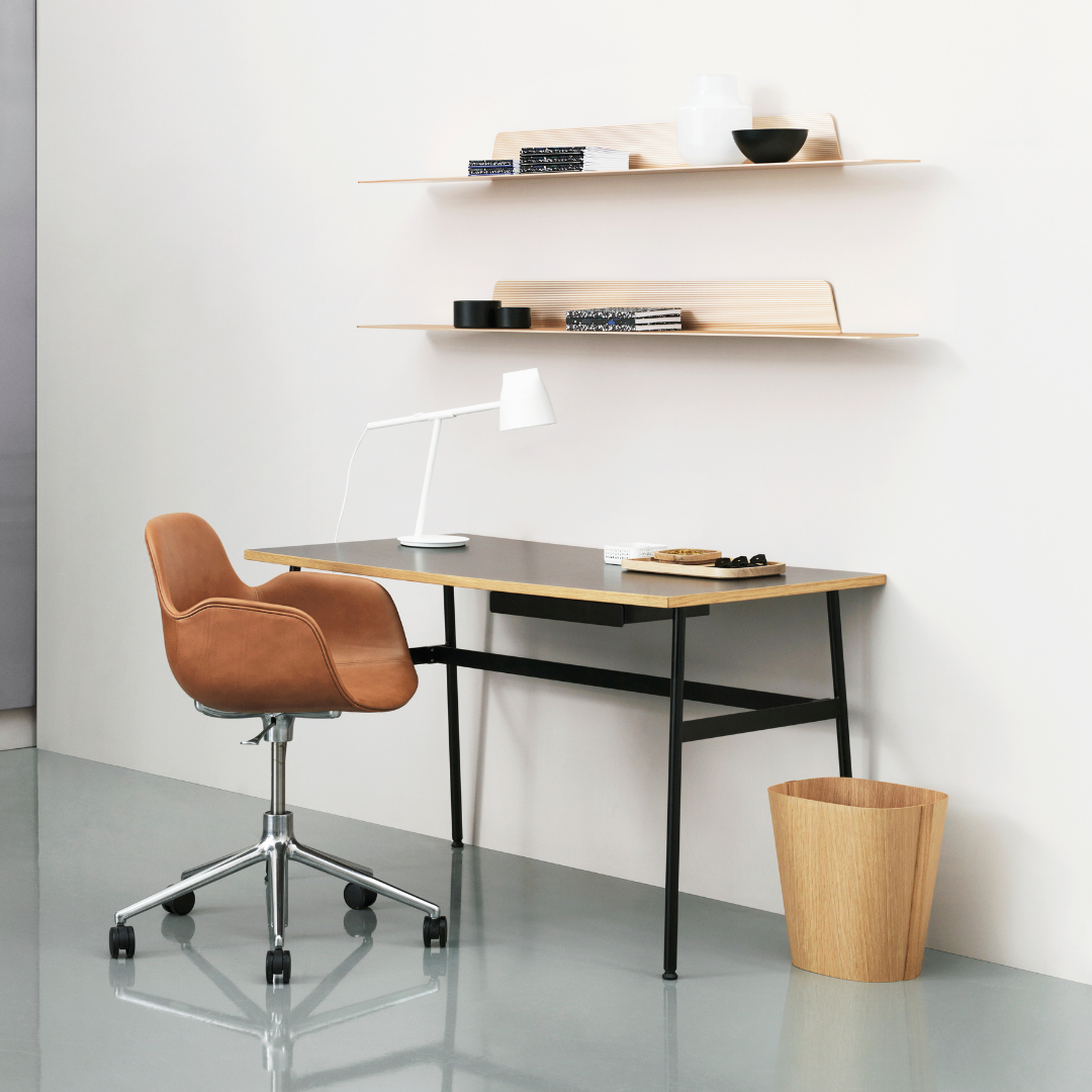 The Journal Desk by Normann Copenhagen celebrates simple and modern design that fits into any space throughout the home. This minimal desk offers all the essentials including a hole for power cords and a sleek steel drawer for daily-used office supplies.