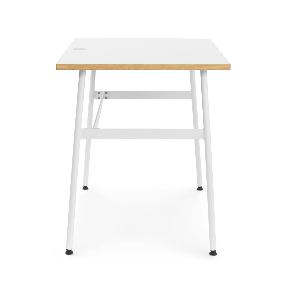 The Journal Desk by Normann Copenhagen celebrates simple and modern design that fits into any space throughout the home. This minimal desk offers all the essentials including a hole for power cords and a sleek steel drawer for daily-used office supplies.