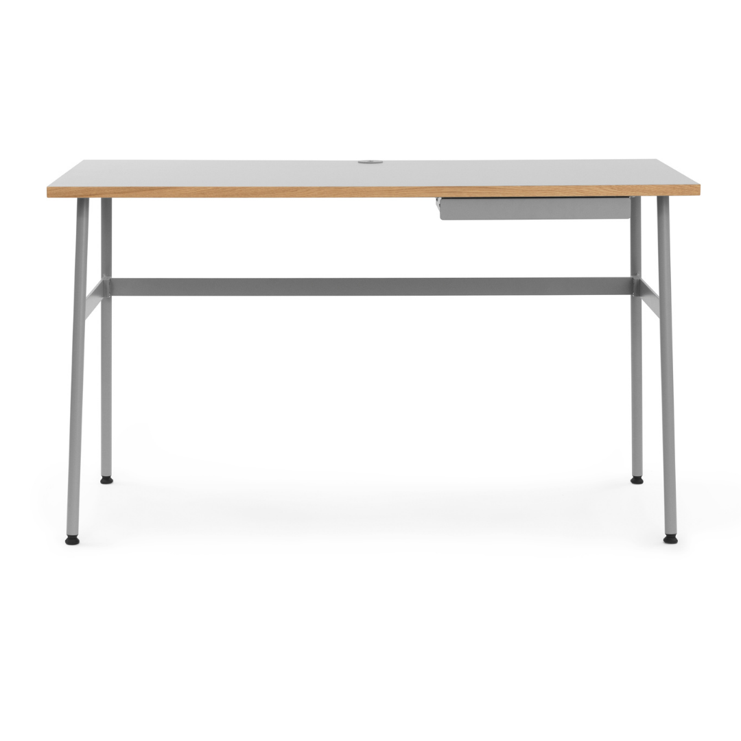 The Journal Desk by Normann Copenhagen celebrates simple and modern design that fits into any space throughout the home. This minimal desk offers all the essentials including a hole for power cords and a sleek steel drawer for daily-used office supplies.