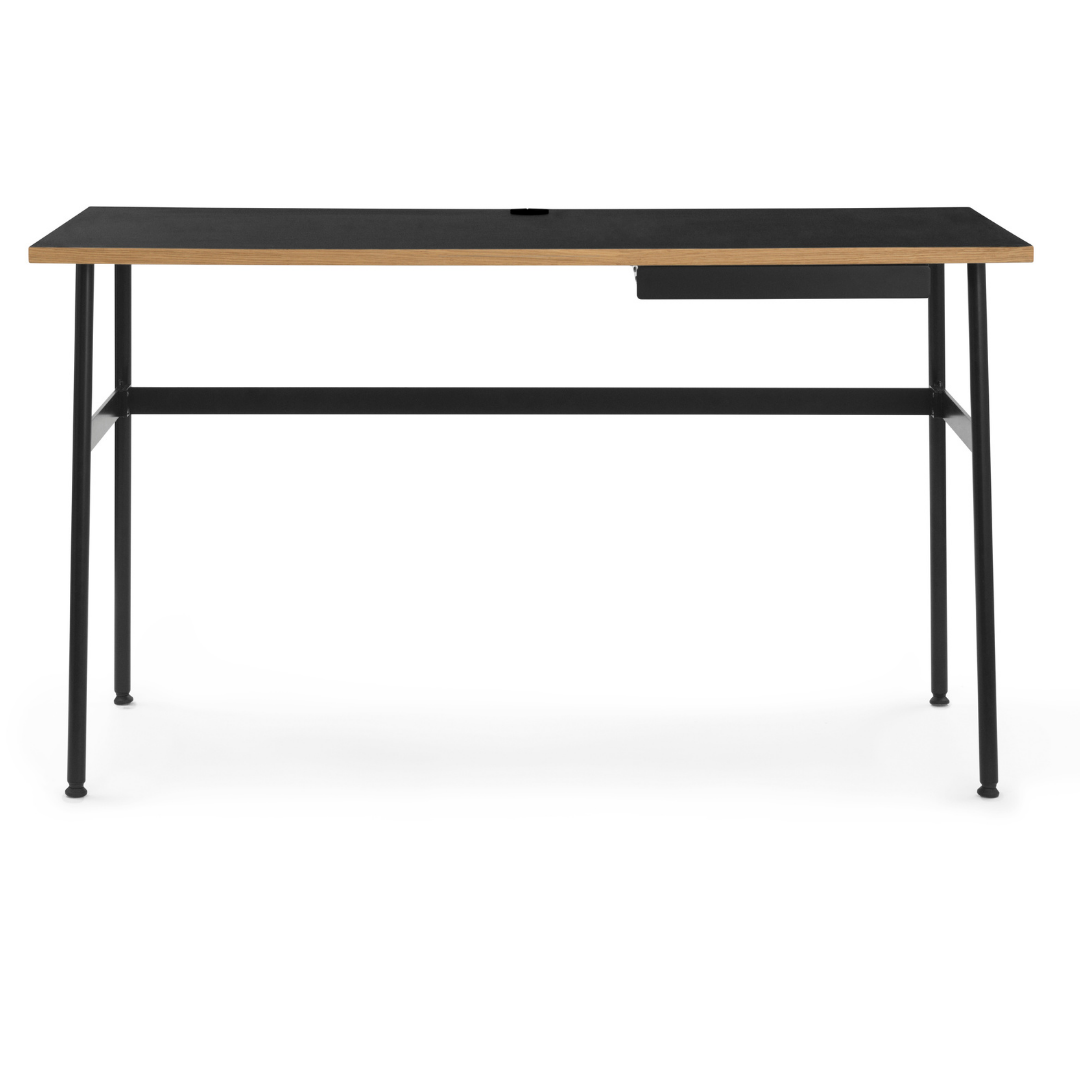 The Journal Desk by Normann Copenhagen celebrates simple and modern design that fits into any space throughout the home. This minimal desk offers all the essentials including a hole for power cords and a sleek steel drawer for daily-used office supplies.