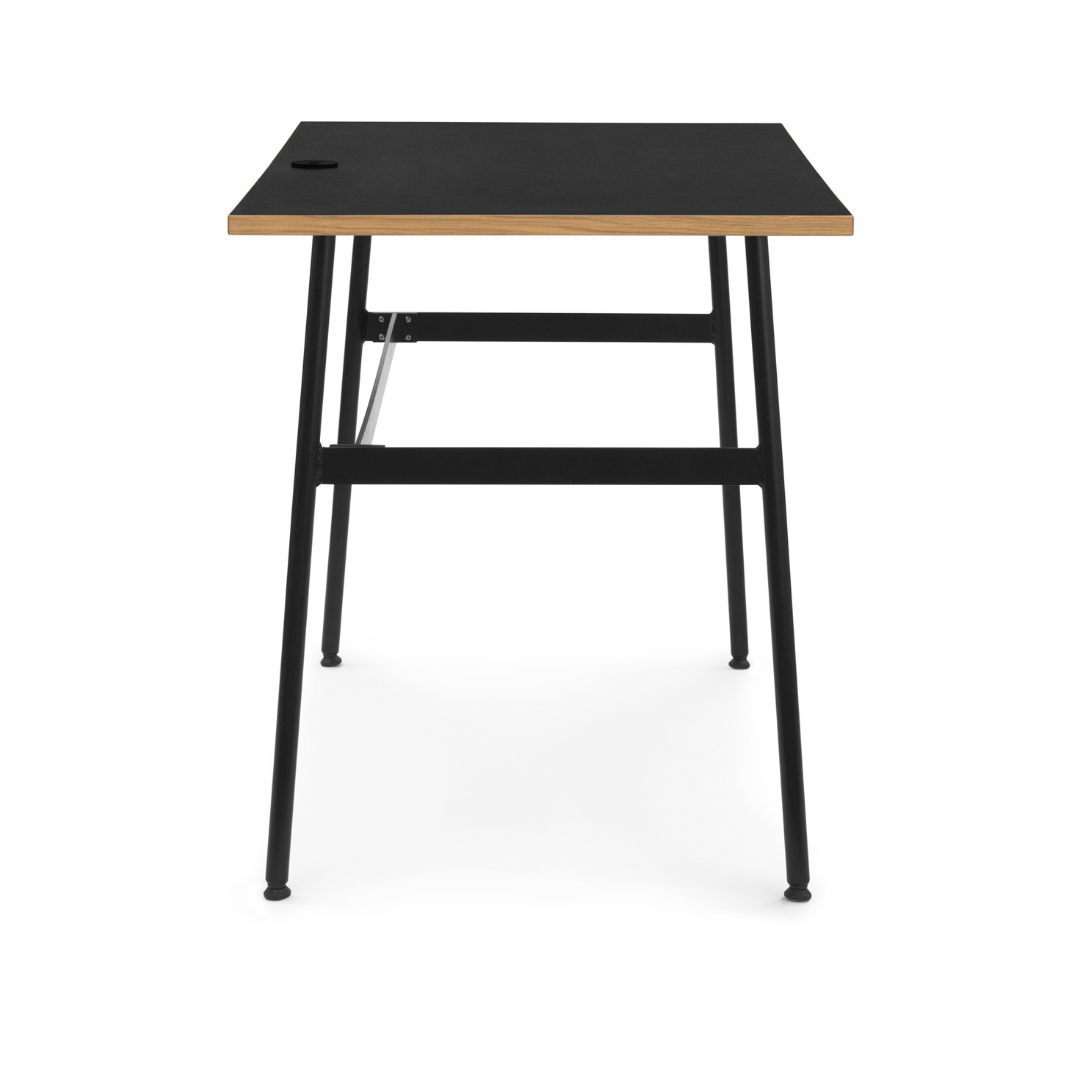 The Journal Desk by Normann Copenhagen celebrates simple and modern design that fits into any space throughout the home. This minimal desk offers all the essentials including a hole for power cords and a sleek steel drawer for daily-used office supplies.