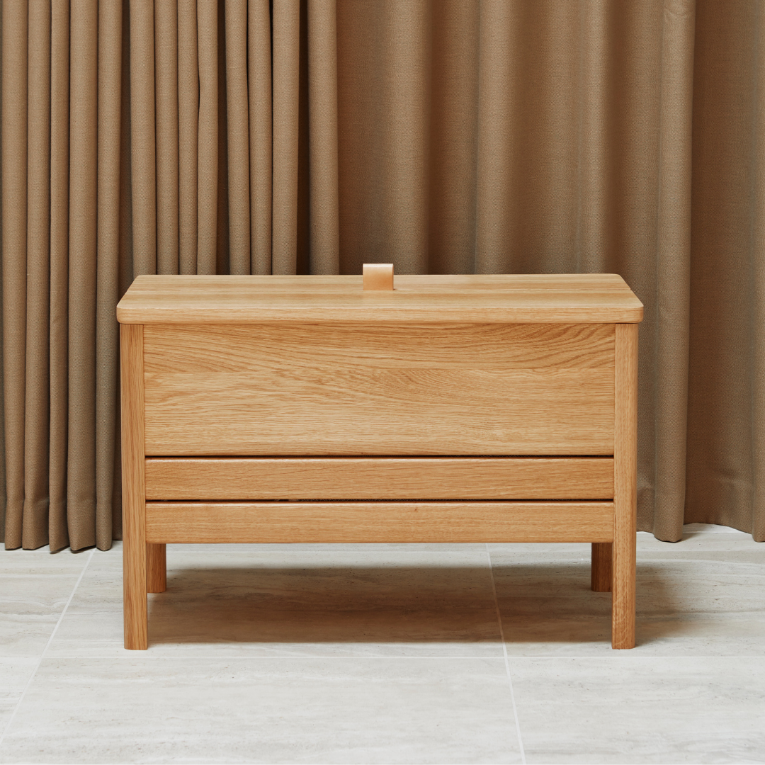 The A Line Storage Bench by Form and Refine is an updated and minimal storage bench with clean lines and solid wood construction, perfect for entryways and bedrooms.