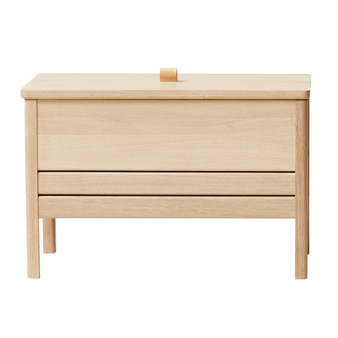 The A Line Storage Bench by Form and Refine is an updated and minimal storage bench with clean lines and solid wood construction, perfect for entryways and bedrooms.