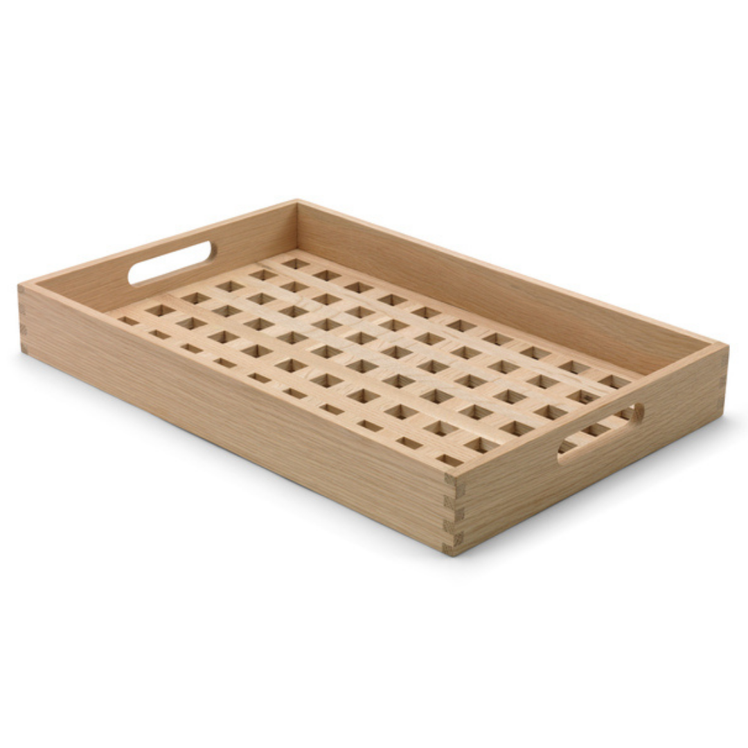 The Skagerak Fionia Tray is a modern, rectangular tray that can be used in a variety of spots throughout the home. We love it styled on a bed side table or bench at the base of a bed, but it can also be used when hosting guests outdoors or in the dining room. It's beautiful and simplistic, and will quickly become an item you use often.