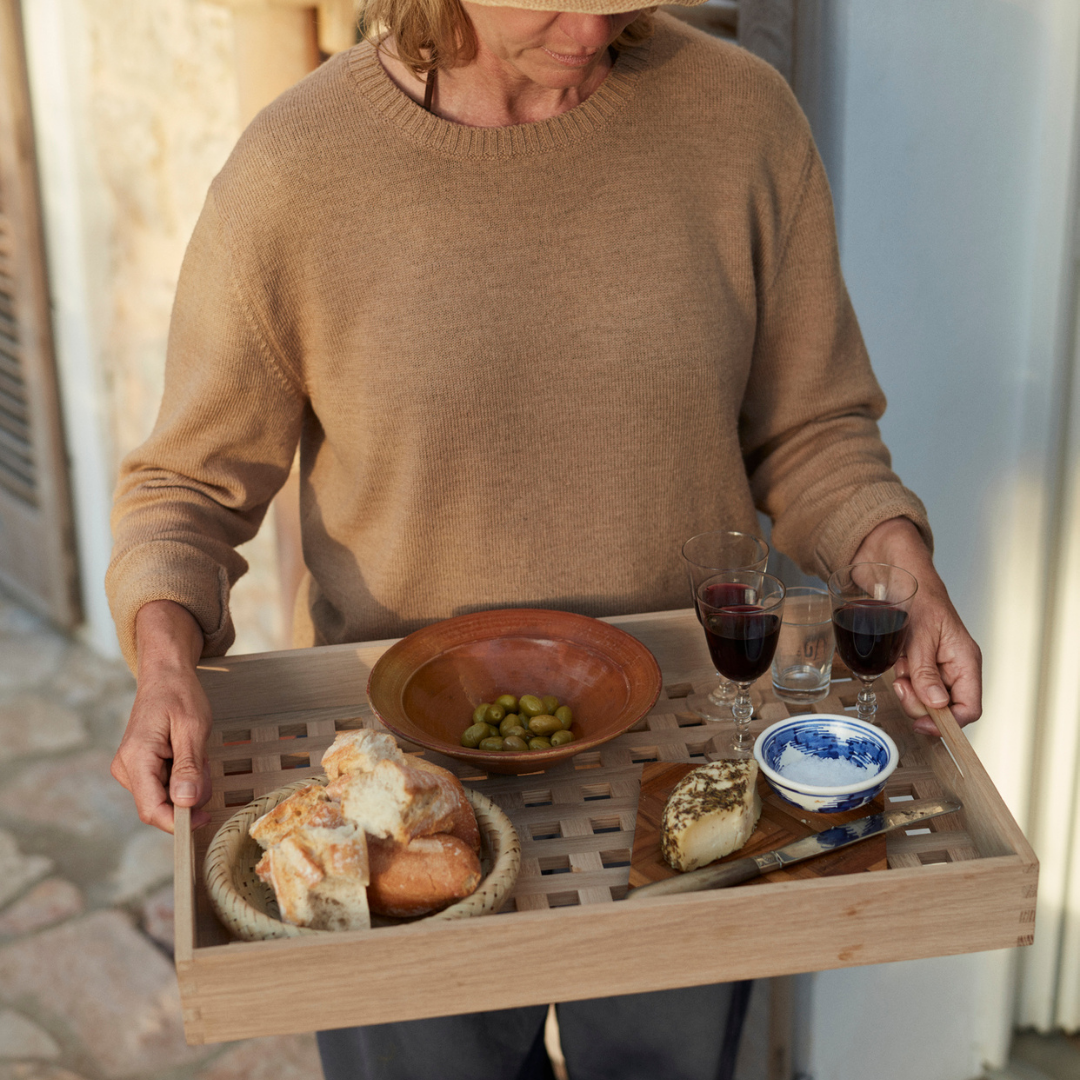 The Skagerak Fionia Tray is a modern, rectangular tray that can be used in a variety of spots throughout the home. We love it styled on a bed side table or bench at the base of a bed, but it can also be used when hosting guests outdoors or in the dining room. It's beautiful and simplistic, and will quickly become an item you use often.