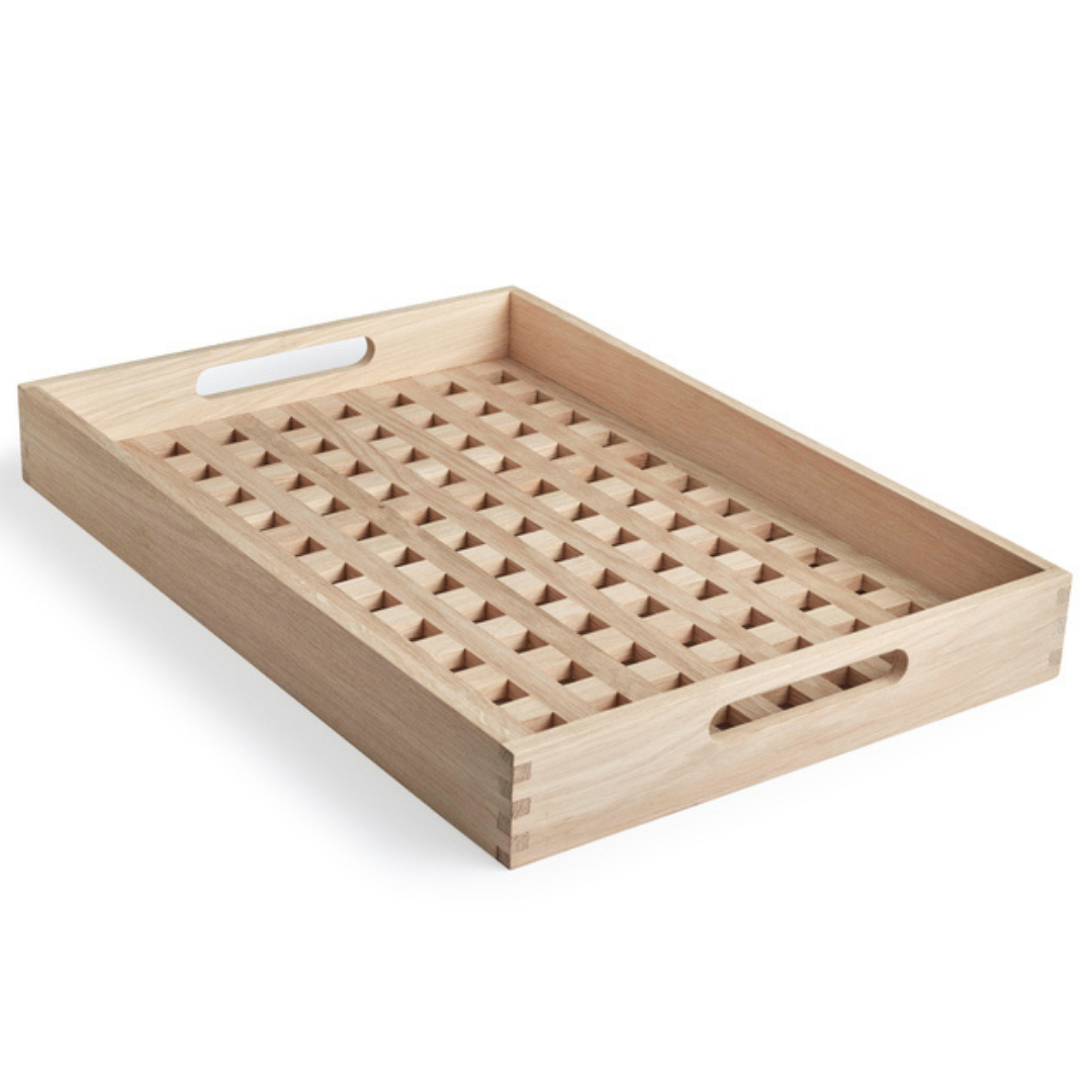 The Skagerak Fionia Tray is a modern, rectangular tray that can be used in a variety of spots throughout the home. We love it styled on a bed side table or bench at the base of a bed, but it can also be used when hosting guests outdoors or in the dining room. It's beautiful and simplistic, and will quickly become an item you use often.